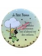 Magnet rond le Petit Prince sur la balançoire  chez Souvenirsdelyon.com